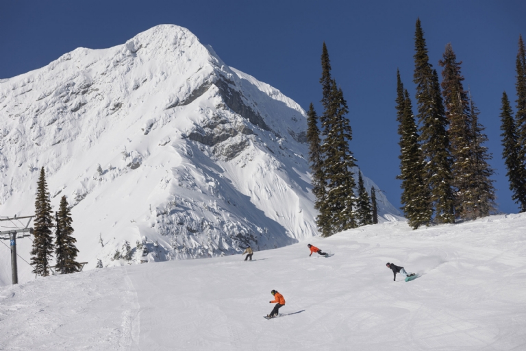 Snowboarding on a bluebird day at Fernie Alpine Resort